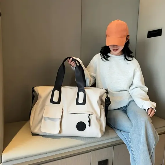 White Large-capacity travel tote bag, lightweight carry-on luggage with shoulder strap, gym bag, portable laptop bag, ideal for short trips, hand-carry style.